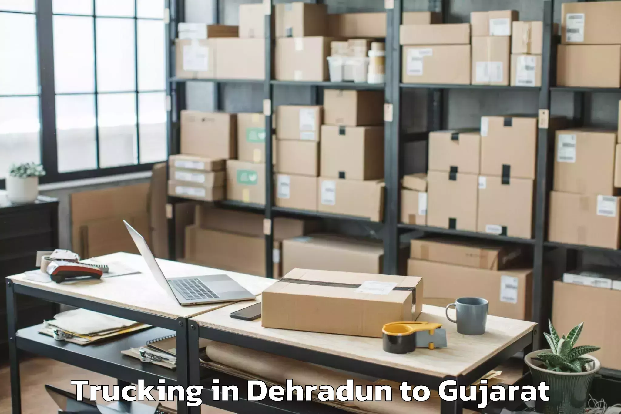 Professional Dehradun to Gujarat National Law Universit Trucking